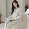 Nuevo conjunto de pijama de punto jacquard elástico de algodón de doble cara para otoño e invierno para mujer, conjunto cómodo de cárdigan de manga larga de alta gama para estar en casa.
