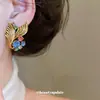 Pendientes de botón redondos estilo cola de pez incrustados con diamantes vintage, pendientes de nicho retro a la moda, pendientes de lujo ligero de alta gama para mujer