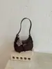 Bolsa de bolinho com design de nicho da moda, nova bolsa de ombro estilosa retrô transfronteiriça em formato de meia-lua, bolsa versátil de ombro e transversal, moderna