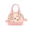 Nova bolsa estilosa para jovens mulheres, perfeita para o trajeto diário.: bolsa de travesseiro com estampa de cereja, bolsa de concha texturizada, bolsa de ombro e bolsa de axila