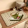 Nueva alfombrilla de secado para cocina hecha de tierra de diatomeas, absorbente y de secado rápido, adecuada para tazas, mesa de té, cafetera y como alfombrilla protectora aislante para escritorio, disponible para venta al por mayor