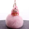 Lindo colgante de llavero de muñeca linda durmiendo, muñeca creativa con corona, imitación de bola de pelo de conejo Rex, colgante de bolsa, venta al por mayor