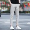 Pantalones casuales de otoño para hombre, estilo nuevo de outlet, versátiles, ajustados, de pierna recta, cónicos, negros para hombre