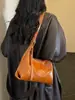 Bolso de mano para mujer 2026 nuevo simple color liso nicho retro versátil diario para ir al trabajo tote bandolera