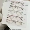 Armazones de anteojos de titanio puro para mujer, estilo business tradicional, colección de anteojos de medio aro ultraligeros, armazón de anteojos Danyang M0043