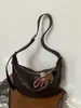 Bolsa feminina estilo vintage para axila 2026 novo modelo bolsa simples de bolinho versátil para ombro e transversal bolsa popular de vendas transfronteiriças