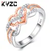 Nuevo anillo creativo popular de moda con patrón de flores en forma de corazón, color dorado, protección electrochapado, anillo de circonita para mujer