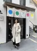 Nuevo estilo de invierno abrigo de lana de doble cara con mangas de punto y capucha, de un solo pecho, simple, de cachemira y lana, engrosado, abrigo cálido
