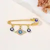 Broche de Borla Olho de Diabo Cravejado de Diamantes Criativo Europeu e Americano, Broche de Estilo Frio para Suéter de Cintura com Olhos Azuis de Alta Qualidade