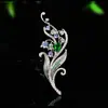 Broche de Lirio del Valle con Diamantes de Color Azul Verdoso Incrustados en las Ramas y Hojas, un Accesorio Elegante para el Trabajo, Eventos Nocturnos y Uso Versátil. Broches al por mayor