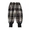 Pantalones de cuadros para niña con forro polar 2026 Nuevo estilo Moda infantil Elegantes para niña Pantalones casuales engrosados Estilo Otoño/Invierno