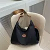 Bolsa de tela de moda casual 2025 Verano Nuevo Bolso Tote de Gran Capacidad Simple Bolso de Hombro Cruzado Bolso Ligero Versátil