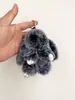 Colgante de conejo de peluche color escarcha con orejas largas que se hace el muerto Accesorio para bolso Colgante de muñeca Mochila Mochila Decoración linda Llavero