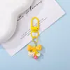 Chaveiro Pingente Urso de Resina Fofo com Laço de Bolinhas Coloridas Decoração de Sacola de Presente Cultural e Criativa DIY