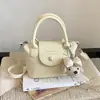 Diseño de Nicho Transfronterizo Moda Versátil Verano 2026 Estilo Nuevo Bolso Cubo de Hombro Cruzado de Alta Gama para Viajes de Trabajo Exquisito