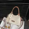 2026 Nova Bolsa de Mão Exclusiva de Alto Padrão para Mulheres Versátil para o Dia a Dia Moda de Nicho Bolsa de Ombro Único Transversal Bolsa de Mão