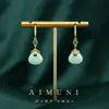 Pendientes antiguos de estilo palaciego con imitación de jade Hetian y nubes auspiciosas para mujer, adecuados para vestidos tradicionales chinos y Hanfu, con un sentido de lujo y sofisticación