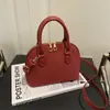 Bolsa de Mão da Moda Tendência de Nicho para Mulheres 2026 Novo Estilo Versátil Bolsa Concha Elegante Bolsa Transversal para o Dia a Dia