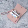 Porta-moedas de Mão Porta-cartões Feminino 2025 Novo Couro Macio com Textura de Lichia Zíper Pequena Bolsa de Moedas Bolsa de Moedas Tendência
