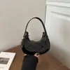 Bolso de Mano de Color Sólido con Forma de Media Luna Estilo Francés de Nicho Otoño 2026 Nuevo de Moda Casual Texturizado Bolso de Hombro para Debajo del Brazo