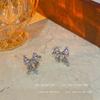 Pendientes de lazo rosa súper hada delicados y dulces, diseño de nicho, primavera y verano, sensación avanzada, sin agujeros para las orejas, espiral antimosquitos, clip para las orejas