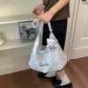 Bolsa de lona floral casual al por mayor para mujer, nueva bolsa versátil para el hombro y cruzada para el día a día 2026, bolsa de mano de gran capacidad