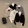 Top de punto Guangzhou Thirteen Lines imis*2026 mezcla de lana color de bloqueo otoñal/invernal estilo dos piezas falsas ajustado para mujer