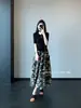 Linho~Saia Elegante Francesa de Comprimento Médio Estilo Férias Estampa Floral Barra Larga Saia Midi Evasê Feminina 2026 Nova