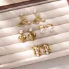 Brincos Pendentes Coração Estrela Retrô Ouro 18K Aço Inoxidável com Pérola Embutida Brincos Femininos Novo Design Quente Transfronteiriço