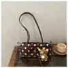 Comercio exterior transfronterizo minimalista con colgante de lunares 2026 terciopelo moda gran capacidad estilo coreano bandolera para el trabajo bajo el brazo para mujer