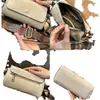 Bolso de mano estilo retro, bolsa para el teléfono del trabajo, bolso cruzado para mujer, nueva moda primavera/verano 2026, bolso pequeño único y elegante, versátil