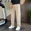 Pantalones casuales holgados versátiles para hombre en otoño e invierno, forrados de felpa, color liso, transpirables, elásticos, con una caída fresca, modernos pantalones de chándal nuevos