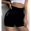 Pantalones de yoga de verano de cintura alta que contraen el abdomen elásticos de levantamiento de glúteos tipo durazno mallas anti-exposición secado rápido shorts deportivos de fitness para mujer