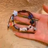 Pulseira Trançada com Botões Xadrez Estrela do Mar Azul Claro 2025 Novo Estilo de Férias Joias Pequenas Frescas de Beira-Mar