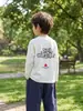 Camiseta de manga larga para niño con mangas raglán, top infantil para niños mayores, nuevo estilo otoño 2026, camiseta básica de color liso con cuello redondo, moderna