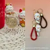 Oro Puro 999 Labubu Pequeña Galleta Colgante de Oro Yeso Gatito Pequeño Serie Cordón Tienda de Oro Actividad de Impulso de Tráfico Regalo Pequeño