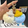 Llavero de haba pequeña de pelo sintético colgante de felpa hecho a mano llavero de alto valor de color llavero diy regalo de nicho elfo
