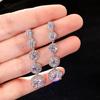 Pendientes largos de circonitas brillantes de estilo europeo y americano Cao Shi para mujer, sencillos, combinables, elegantes y delgados.