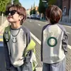 Camiseta de manga larga raglán de algodón puro para niños, nuevo estilo primavera/otoño con estampado color block, moderna y única, adecuada para niños de talla mediana y grande como capa base.