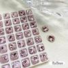 Accesorios populares para uñas Diamante K9 puntiagudo polvo flor de cerezo rosa súper brillante corazón torcido huevo de paloma rectangular diamante para pegar en uñas al por mayor