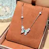 Pendientes de Plata de Ley S925 con Aguja, Estilo Temperamento, Mariposa Azul Diamante Cepillado para Mujer, Artesanía Asimétrica de Nicho, Collar Pulsera de Gama Alta