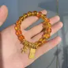 Libro Rojo Pequeño Imitación Rubio Cristal Dorado Año del Caballo Pulsera de Dinero Nueva para Mujer Lujo Accesible Diseño de Nicho Pulsera de Cristal Torre Amarilla de Gama Alta