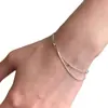 Pulsera de hueso de serpiente con cuentas plateadas de doble capa, estilo minimalista coreano, versátil para el uso diario, exquisitamente diseñada y con un toque sofisticado y de alta gama; venta al por mayor de cadenas delicadas