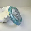 Yongge Jewelry Pulsera de Resina Irregular Curva con Brillo Transfronteriza Accesorio de Mano Exagerado Cuadrado Láser de Gama Alta