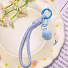Lanyard con llavero de pompón de colores, correa de muñeca portátil anti-pérdida, accesorio colgante versátil para bolso, accesorio para joyería DIY