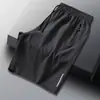 Pantalones Cortos Casuales de Verano para Hombre Estilo Coreano Moderno Bolsillo Cremallera Baratos de Longitud Media Cintura Elástica Pantalones Delgados de Seda de Hielo para Hombre