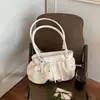 Bolso de cubo plisado elegante de mano para mujer 2026 verano nuevo bolso casual simple de un solo hombro versión coreana sensación de alta gama bolso de mujer