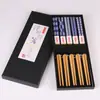 Novos na fábrica Estilo japonês Comércio exterior Impressos Pauzinhos de bambu Cinco azuis azul e branco Porcelana Pauzinhos de bambu para comércio exterior Venda por atacado