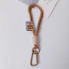 Muñeca de Cuerda Trenzada Llavero de Cuerda de Felpa Cadena Doble para Teléfono Móvil Mosquetón de Nailon Accesorios Colgantes Hechos a Mano para Teléfono Móvil