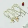 Cadena Colgante de Perlas Flor de Perla Crochet Muñeca Llavero Bolso de Teléfono Móvil Bola Hueca Colgante Cadena de Cuerda